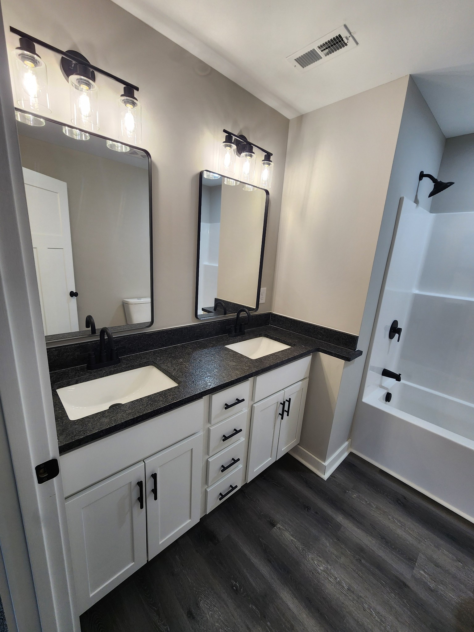 2006 Errel Dowlen Road Pleasant View, TN 37146 - Photo 3 of 15 a bath room with double vanity sink and a mirror