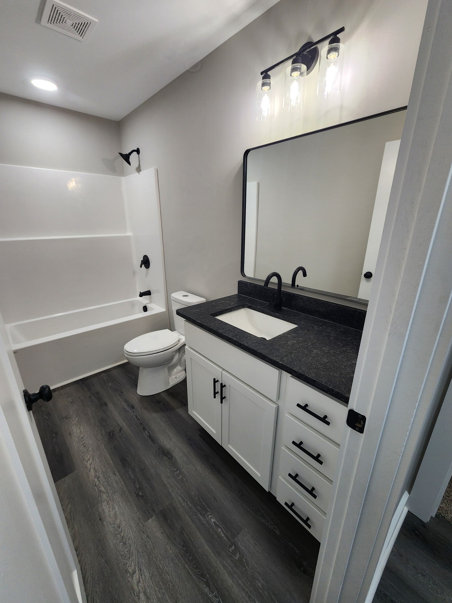 2006 Errel Dowlen Road Pleasant View, TN 37146 - Photo 6 of 15 a bathroom with a sink a toilet a mirror and bathtub
