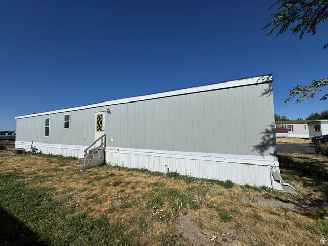 2491 Highway 89, Unit 315 Pleasant View, UT 84404 - Photo 9 of 34 Manufactured home with light blue siding and white trim