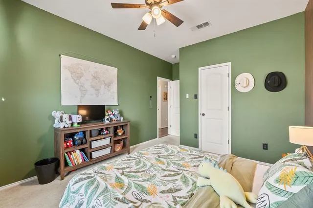 a bedroom with a bed and window