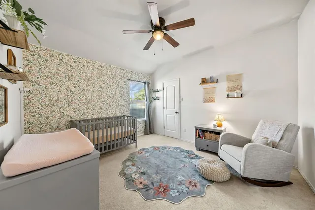 a bedroom with furniture and a window