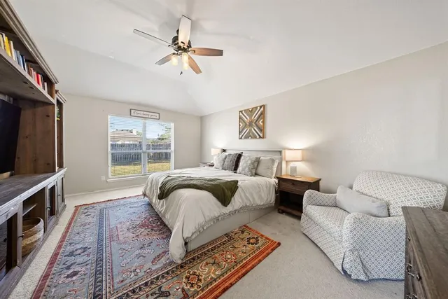 a bedroom with a bed and dresser