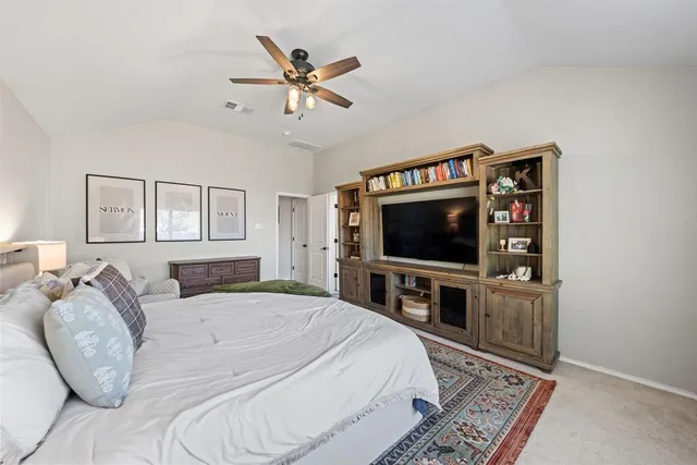 a bedroom with bed and a fireplace