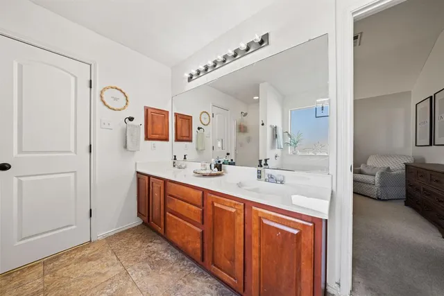 a bedroom with a large bed and a flat screen tv