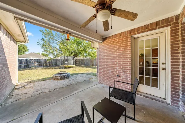 a bathroom with a bathtub sink vanity and mirror