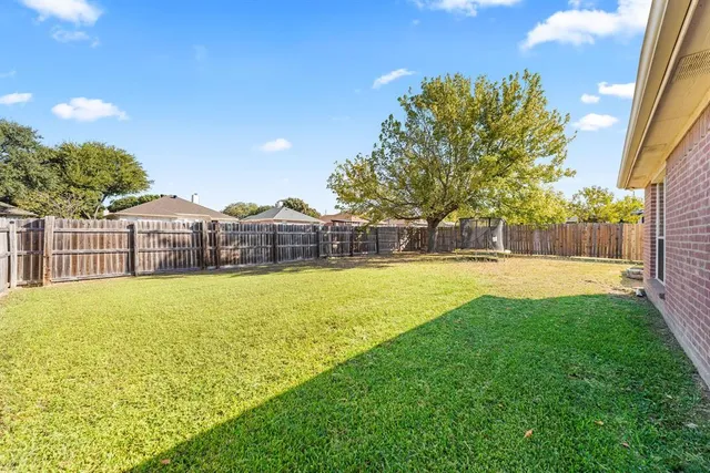 a view of a swimming pool with a lounge chairs