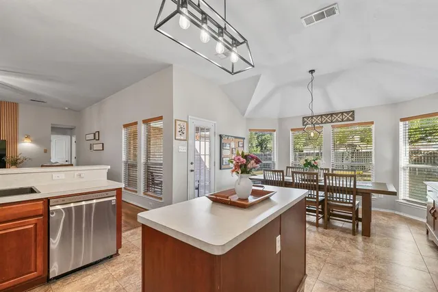 a view of a kitchen and a sink storage and utility