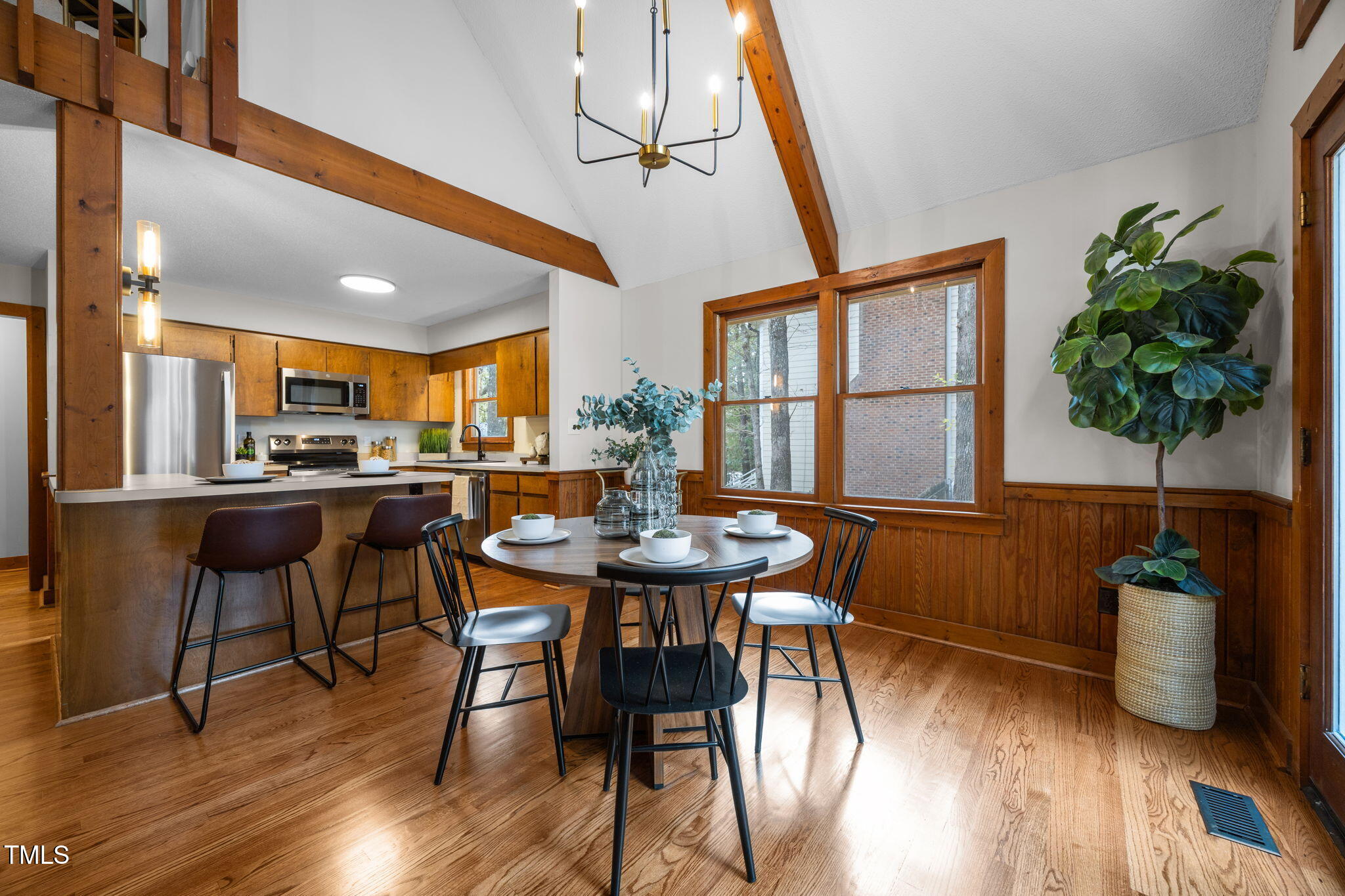 2508 Village Grove Road Raleigh, NC 27613 - Photo 11 of 36 a dining room with furniture and wooden floor