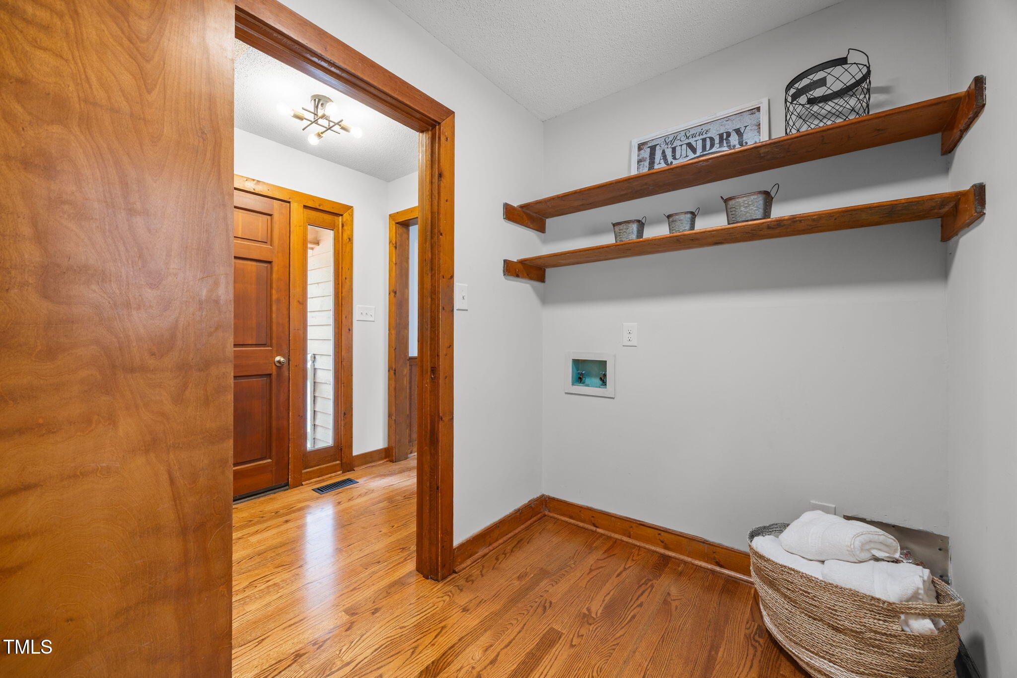 2508 Village Grove Road Raleigh, NC 27613 - Photo 22 of 36 a view of a room with wooden floor