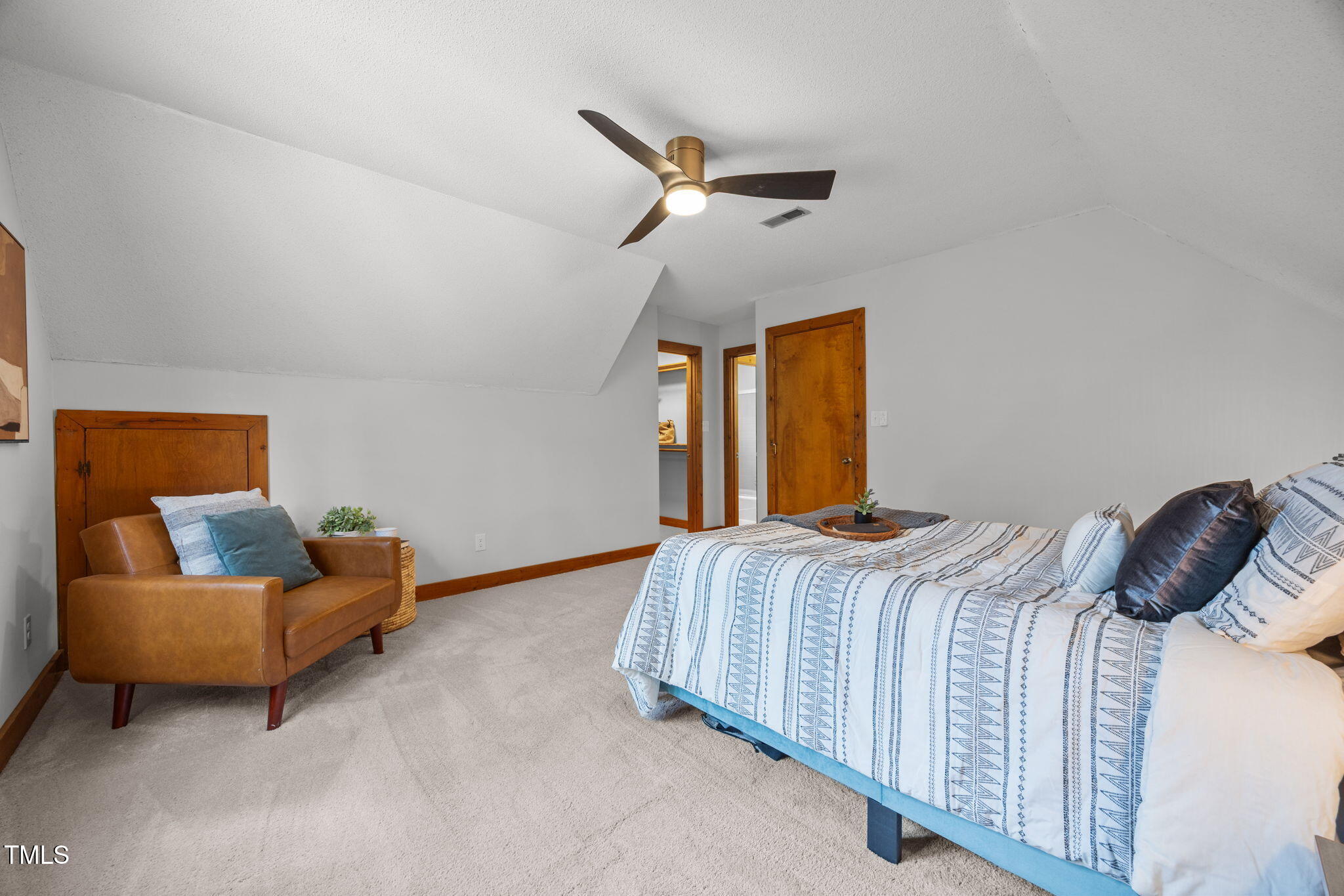 2508 Village Grove Road Raleigh, NC 27613 - Photo 25 of 36 a bedroom with a bed and a couch