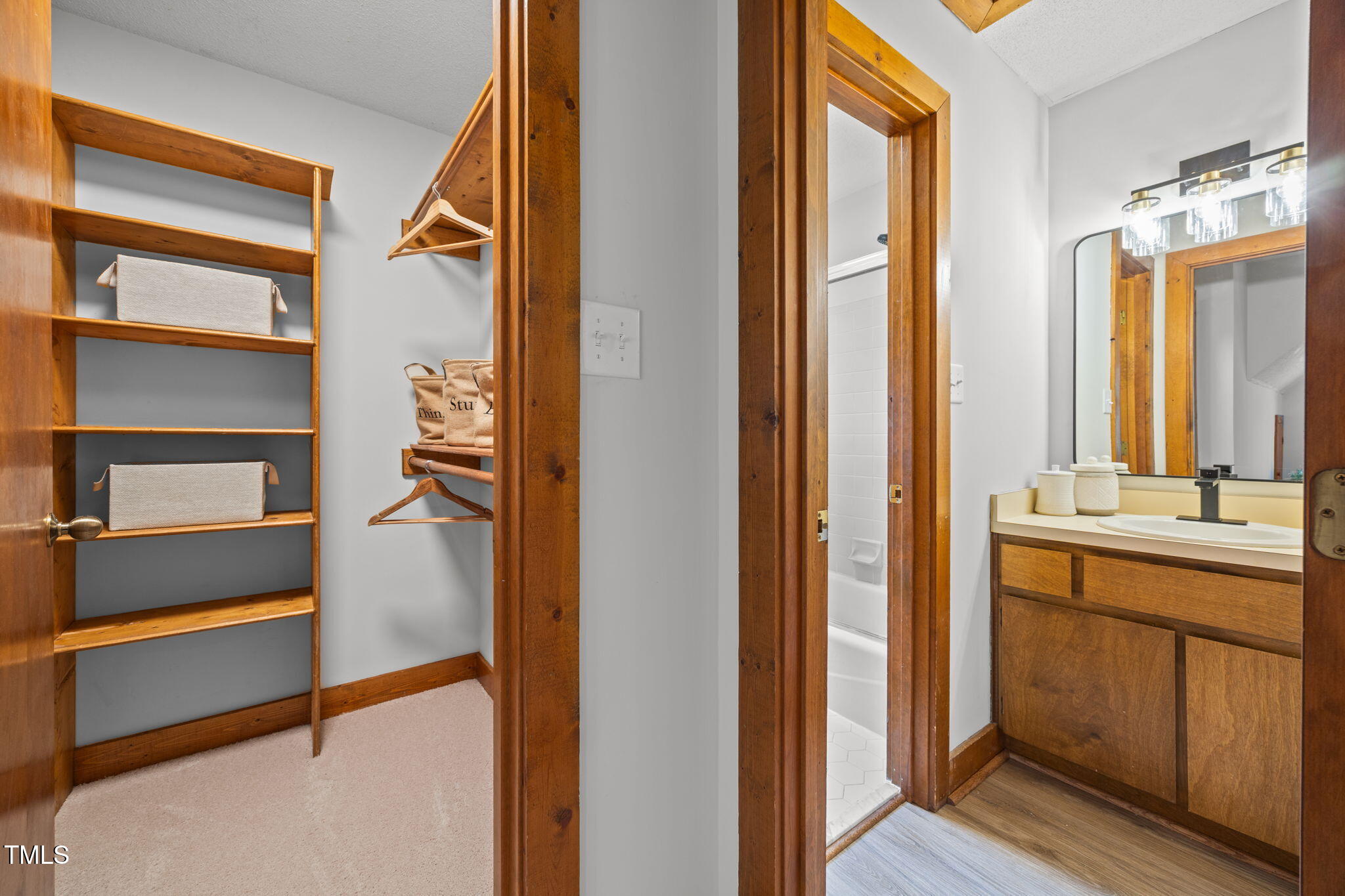 2508 Village Grove Road Raleigh, NC 27613 - Photo 26 of 36 a bathroom with a double vanity sink and mirror