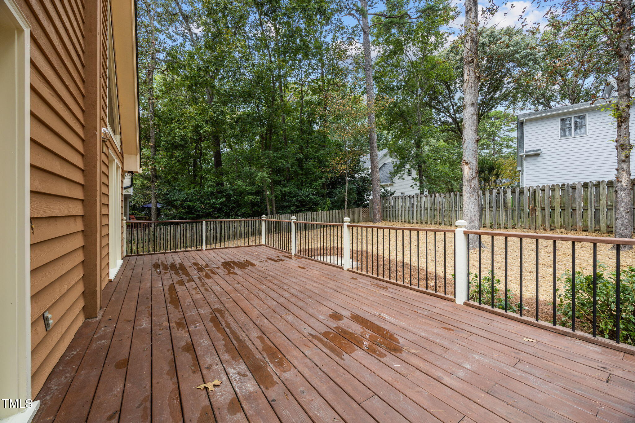 2508 Village Grove Road Raleigh, NC 27613 - Photo 28 of 36 a view of backyard with a deck and wooden floor