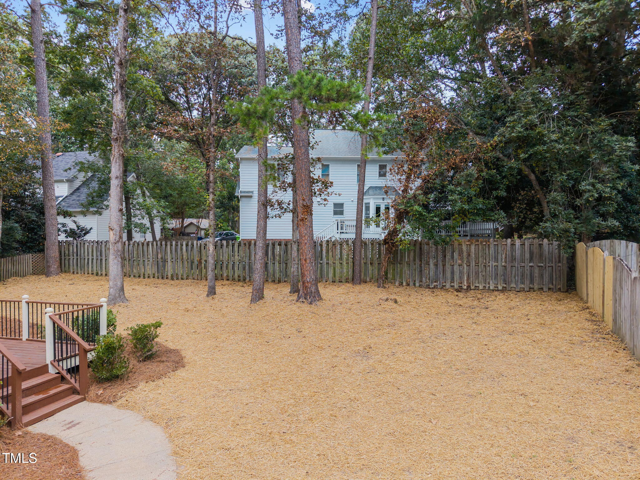 2508 Village Grove Road Raleigh, NC 27613 - Photo 31 of 36 a backyard of a house with lots of trees