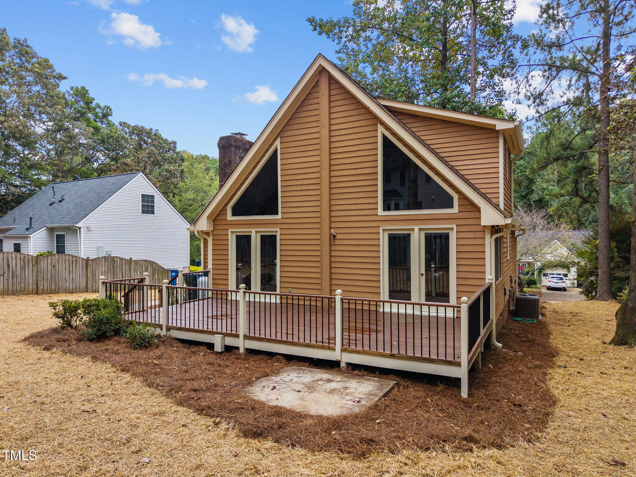 2508 Village Grove Road Raleigh, NC 27613 - Photo 32 of 36 a view of a house with a yard and wooden fence