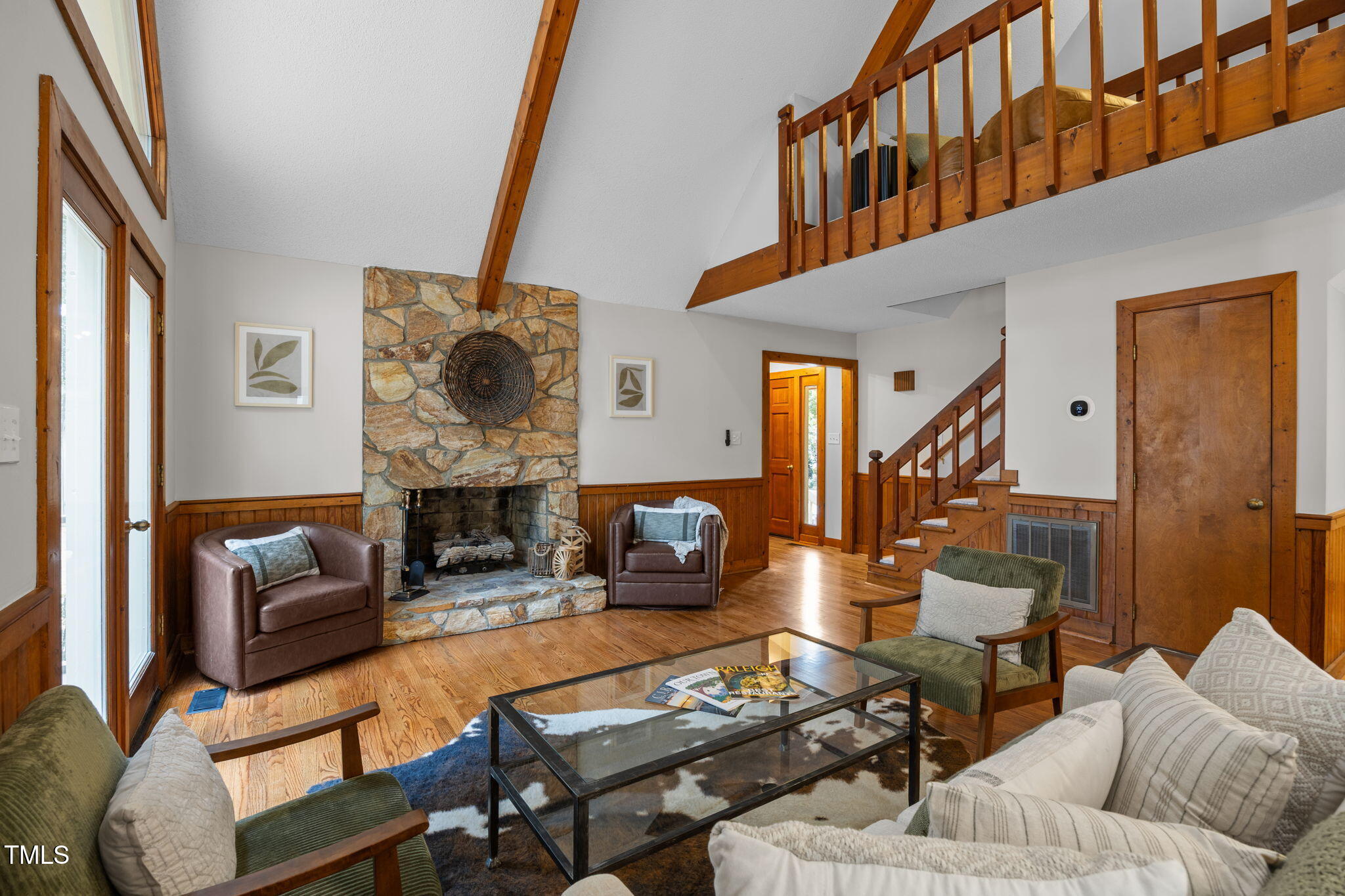 2508 Village Grove Road Raleigh, NC 27613 - Photo 7 of 36 a living room with furniture and a wooden floor
