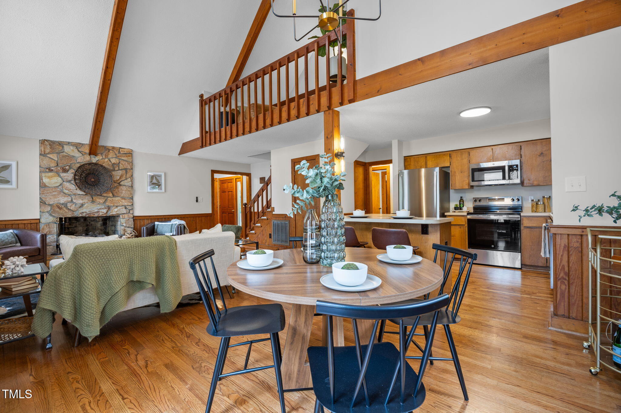 2508 Village Grove Road Raleigh, NC 27613 - Photo 9 of 36 a view of a dining room with furniture and wooden floor