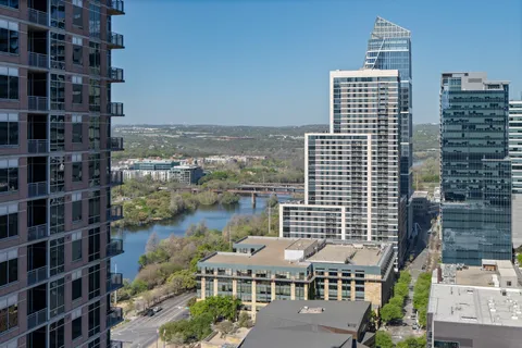 a view of a roof deck with furniture