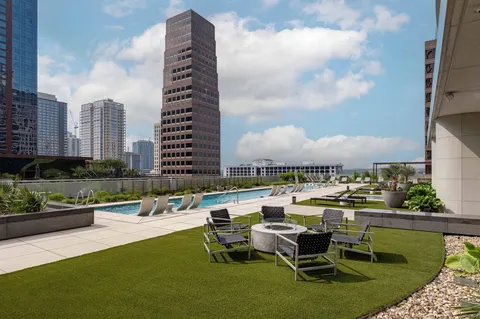 a view of a dining room with furniture and a potted plant