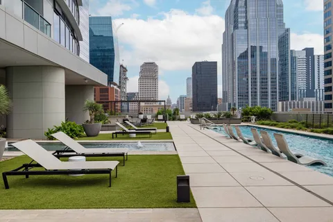 a view of a patio with a table and chairs