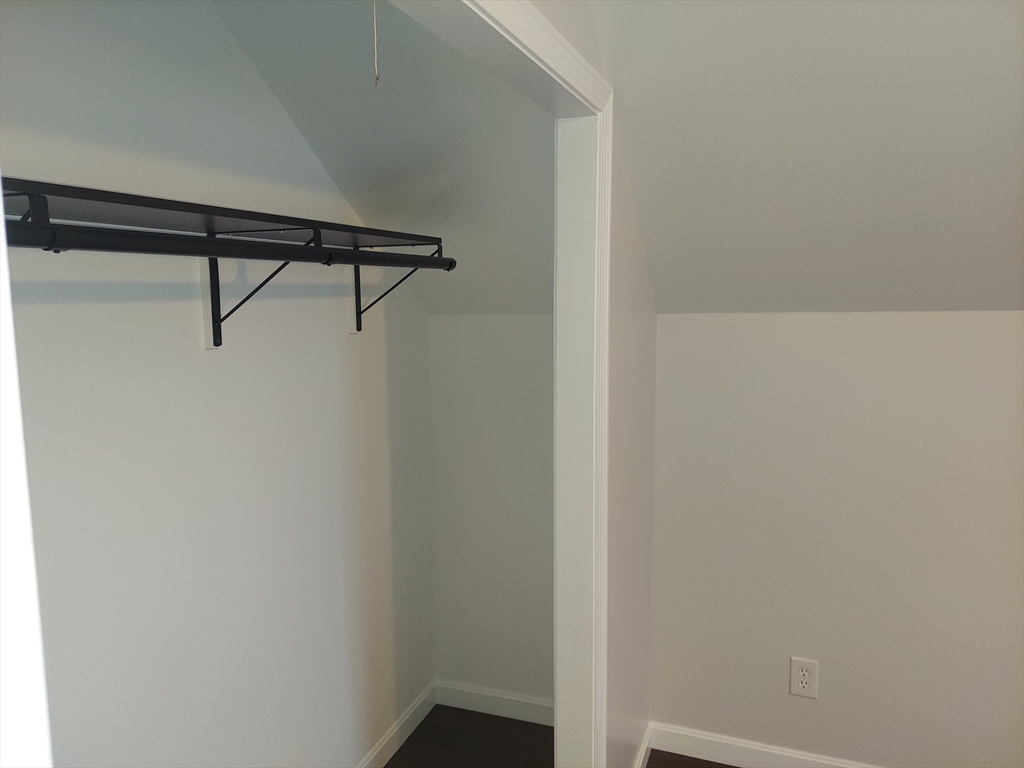 8 Phillips Street Attleboro, MA 02703 - Photo 17 of 17 a view of an empty walk in closet