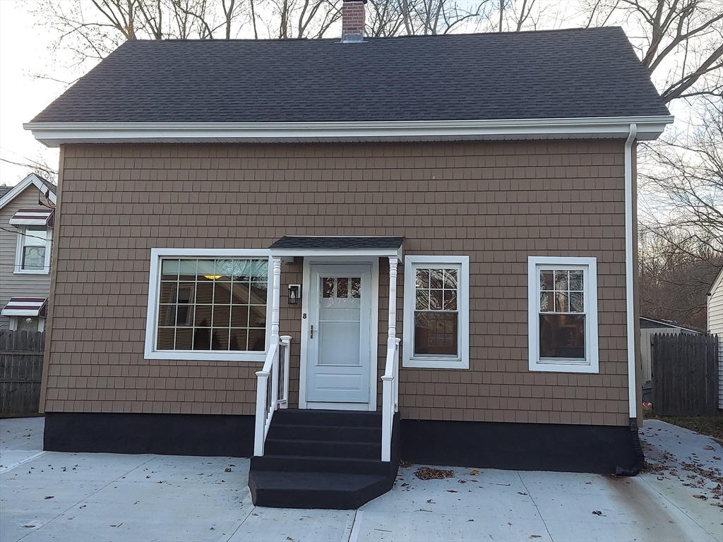 8 Phillips Street Attleboro, MA 02703 - Photo 2 of 17 a front view of a house with a yard