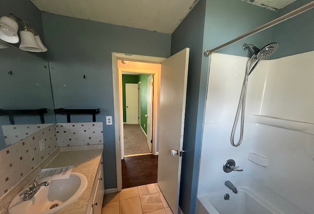 3915 Neeley Avenue Decatur, IL 62526 - Photo 13 of 19 a bathroom with a tub a sink and a shower