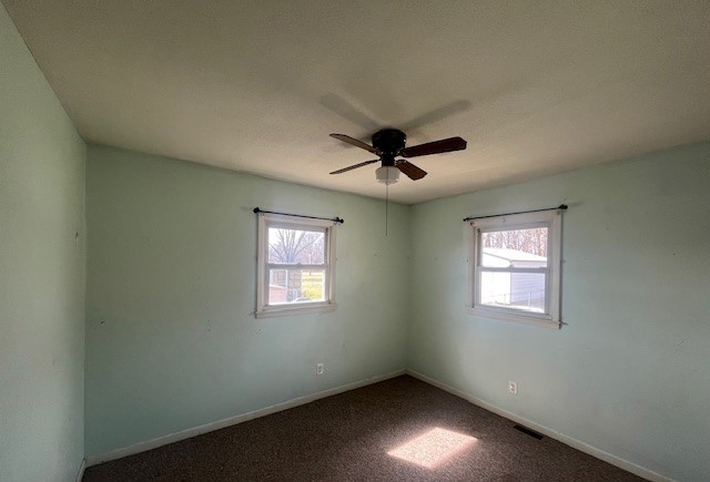 3915 Neeley Avenue Decatur, IL 62526 - Photo 6 of 19 a view of empty room with windows