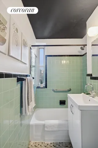 a bathroom with a bathtub and a sink
