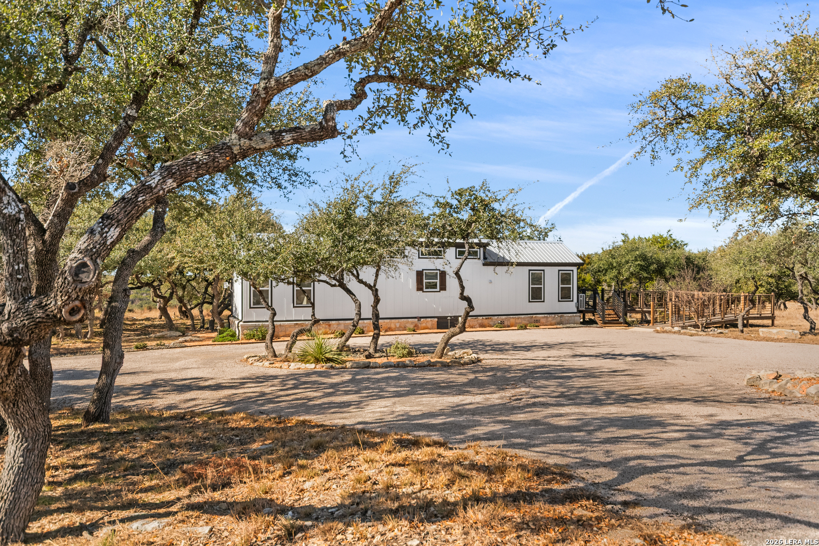292 Fossil Ridge Boerne, TX 78006 - Photo 107 of 144 a front view of a house with a yard covered with snow