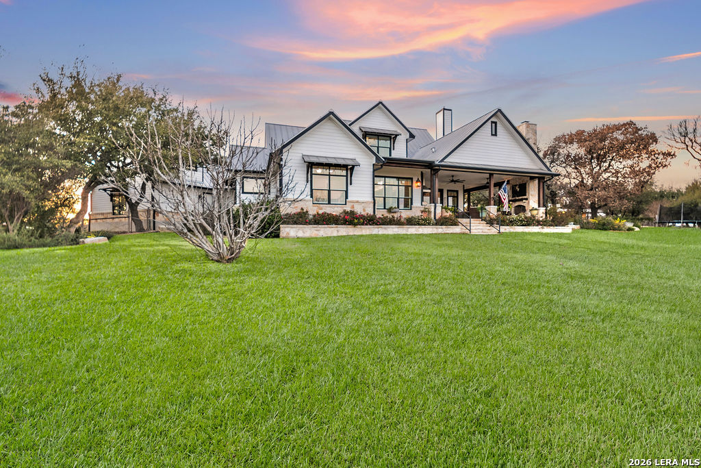 292 Fossil Ridge Boerne, TX 78006 - Photo 111 of 144 a front view of a house with a garden