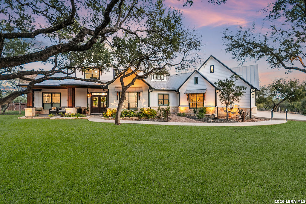 292 Fossil Ridge Boerne, TX 78006 - Photo 130 of 144 a front view of a house with a garden
