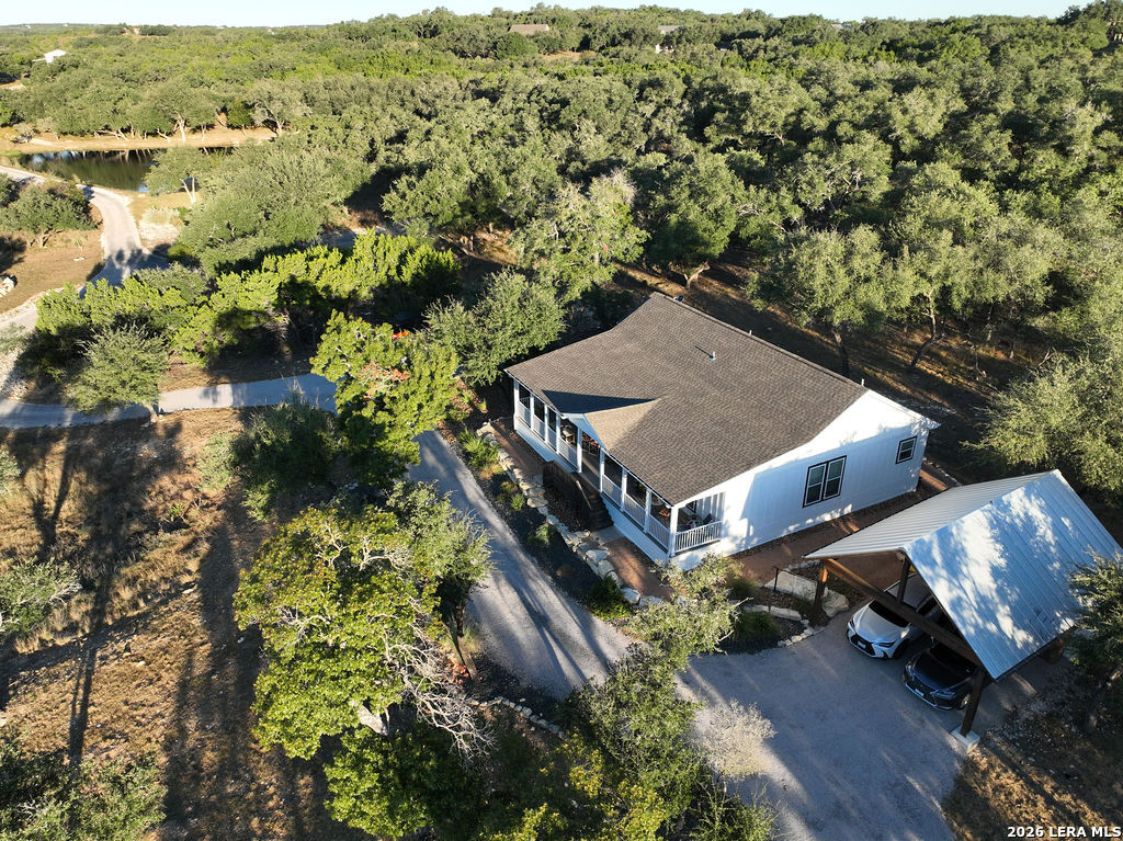 292 Fossil Ridge Boerne, TX 78006 - Photo 144 of 144 an aerial view of a house with a yard and lake view