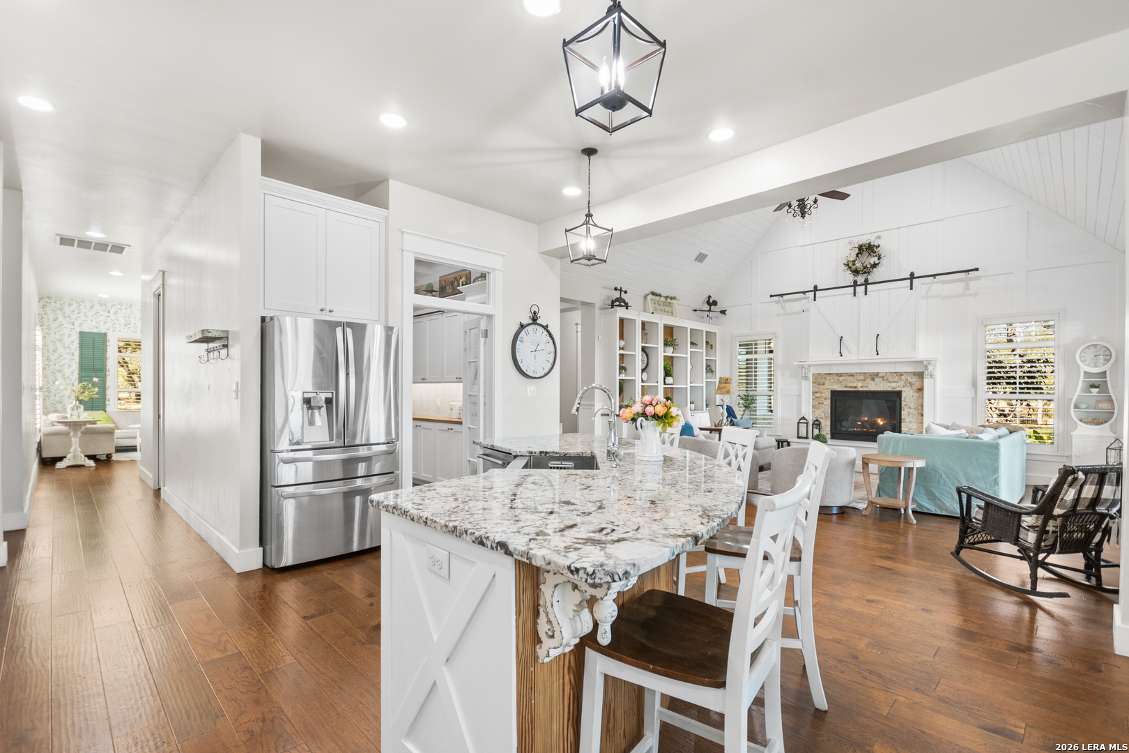 292 Fossil Ridge Boerne, TX 78006 - Photo 25 of 144 a view of a dining room and livingroom with furniture wooden floor a chandelier