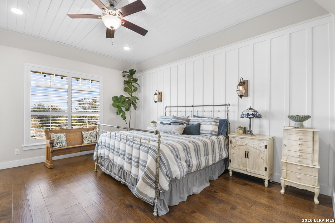 292 Fossil Ridge Boerne, TX 78006 - Photo 29 of 144 a bedroom with a large bed and a chandelier fan