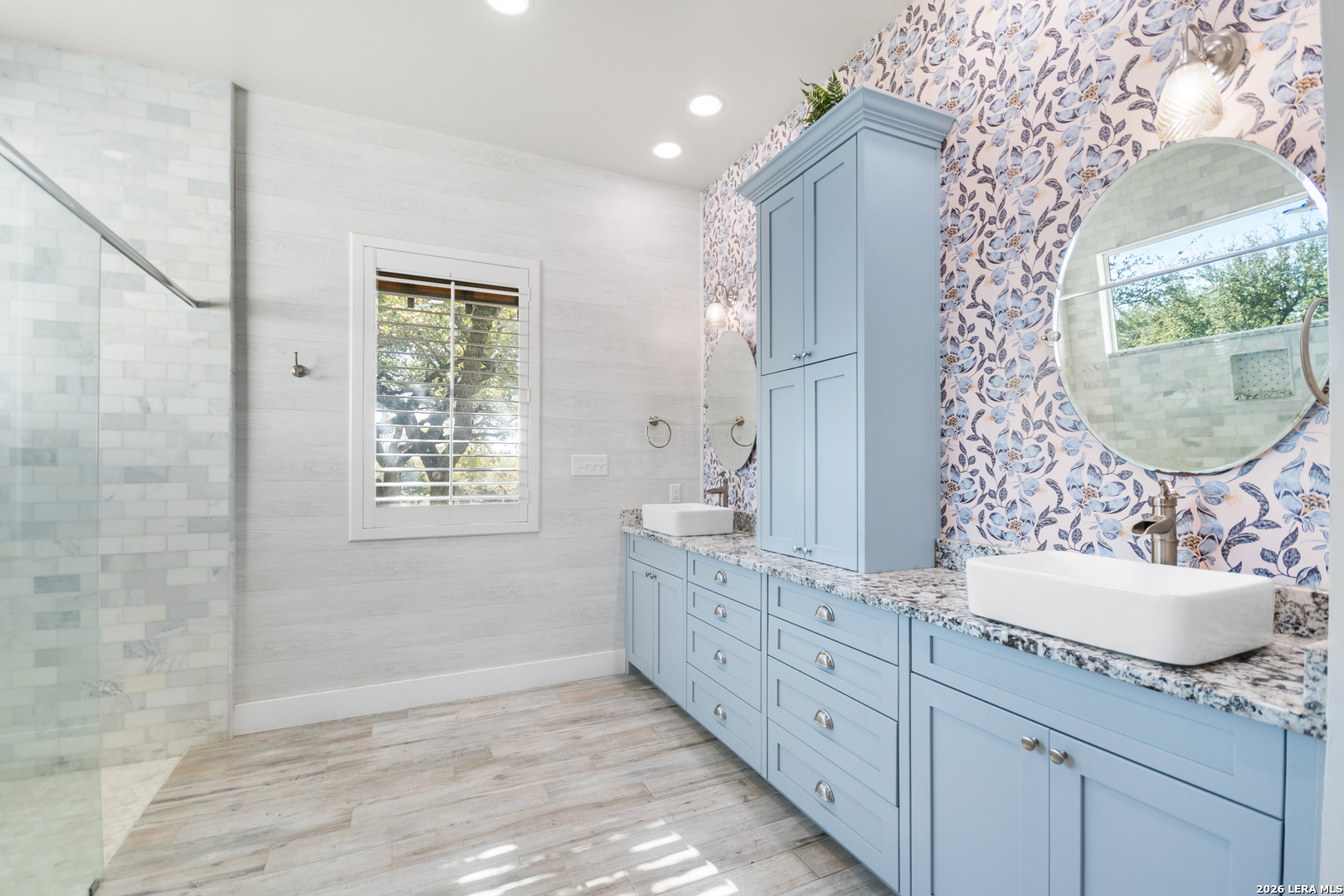 292 Fossil Ridge Boerne, TX 78006 - Photo 30 of 144 a bathroom with a double vanity sink mirror and shower