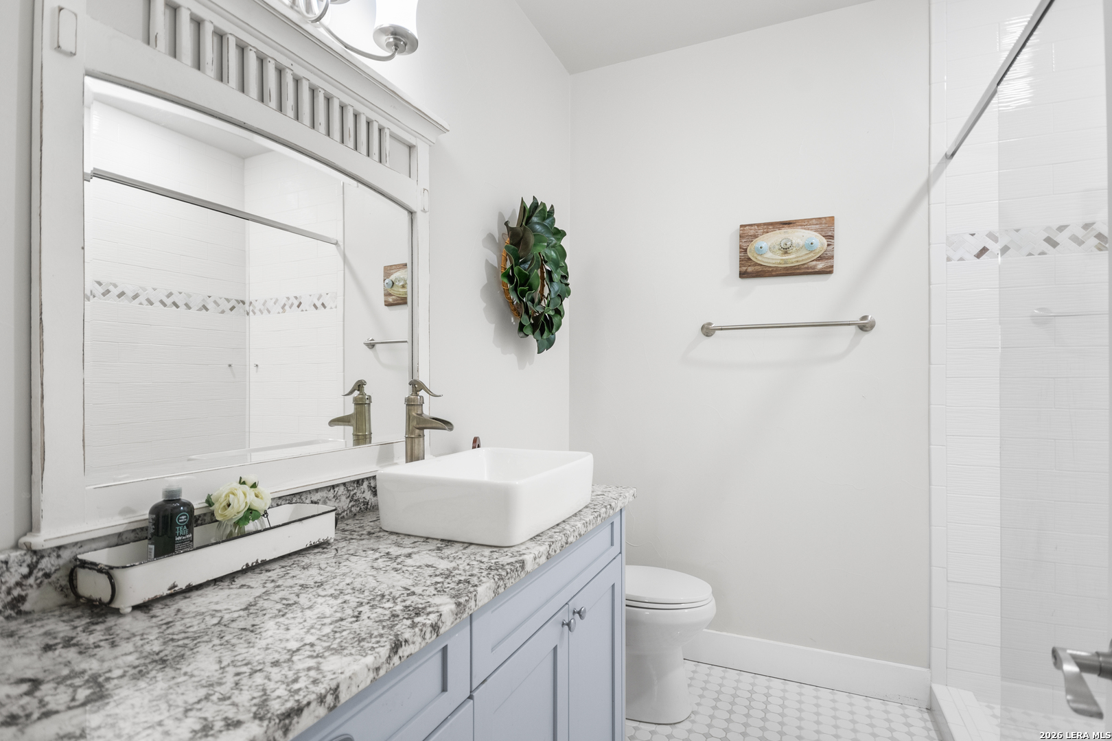 292 Fossil Ridge Boerne, TX 78006 - Photo 83 of 144 a bathroom with a granite countertop sink and a mirror