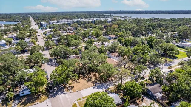an aerial view of a houses with a yard