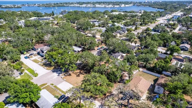 an aerial view of a house with a yard and outdoor seating
