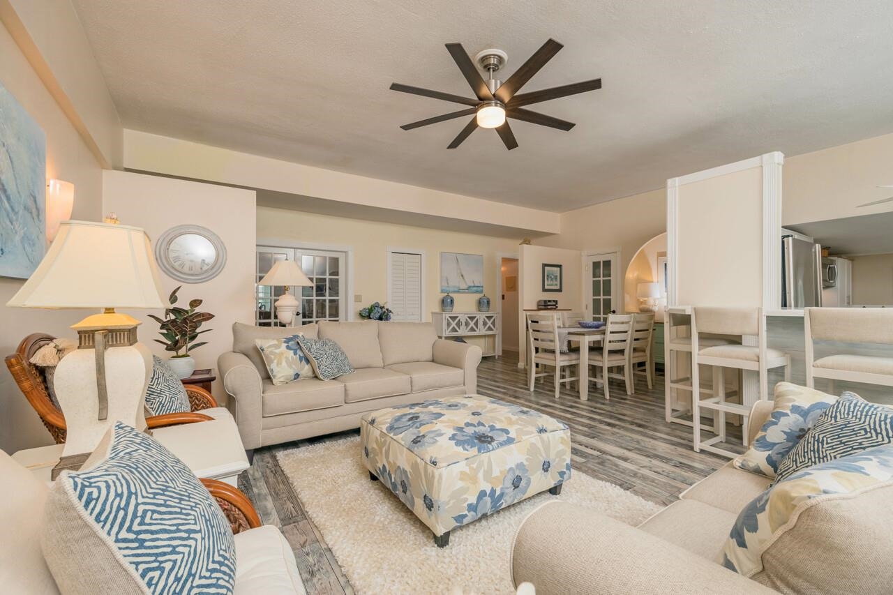 248 Majorca Road St. Augustine, FL 32080 - Photo 10 of 48 a living room with furniture ceiling fan and a rug