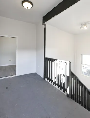 a view of a hallway with windows