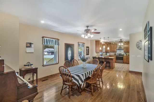 a view of a dining room with furniture and window