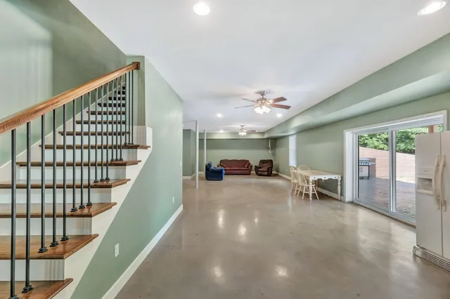 a view of livingroom with furniture and staircase