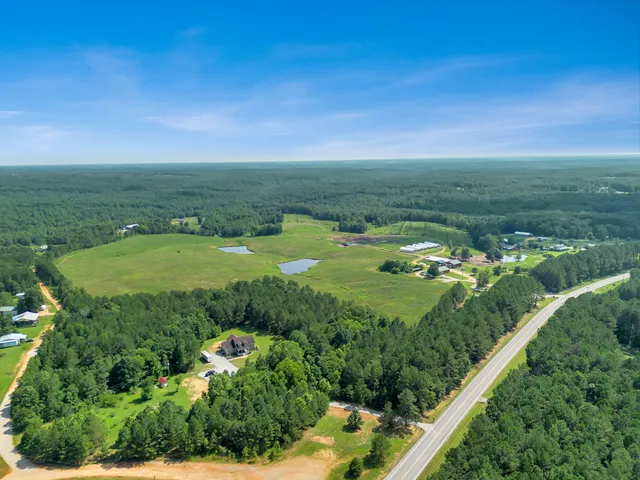 a view of a field with an ocean