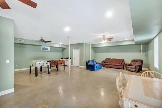 a view of a room with furniture and chandelier