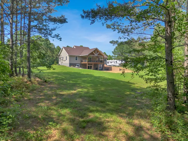 a view of a house with a big yard