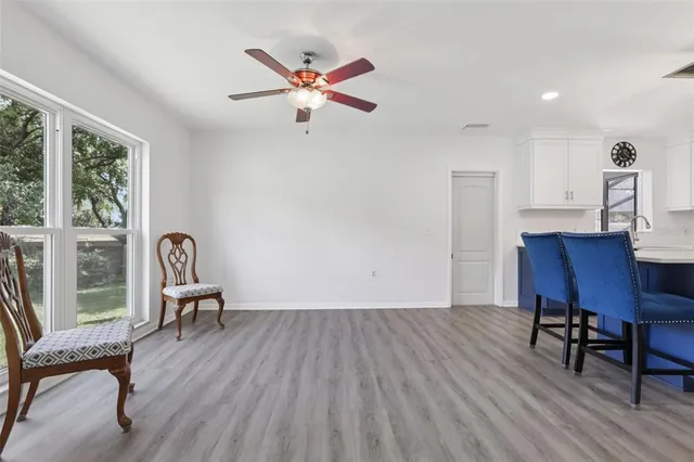 a view of kitchen with cabinets and wooden floor