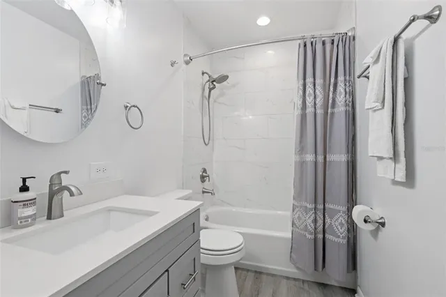 a view of an empty room with windows