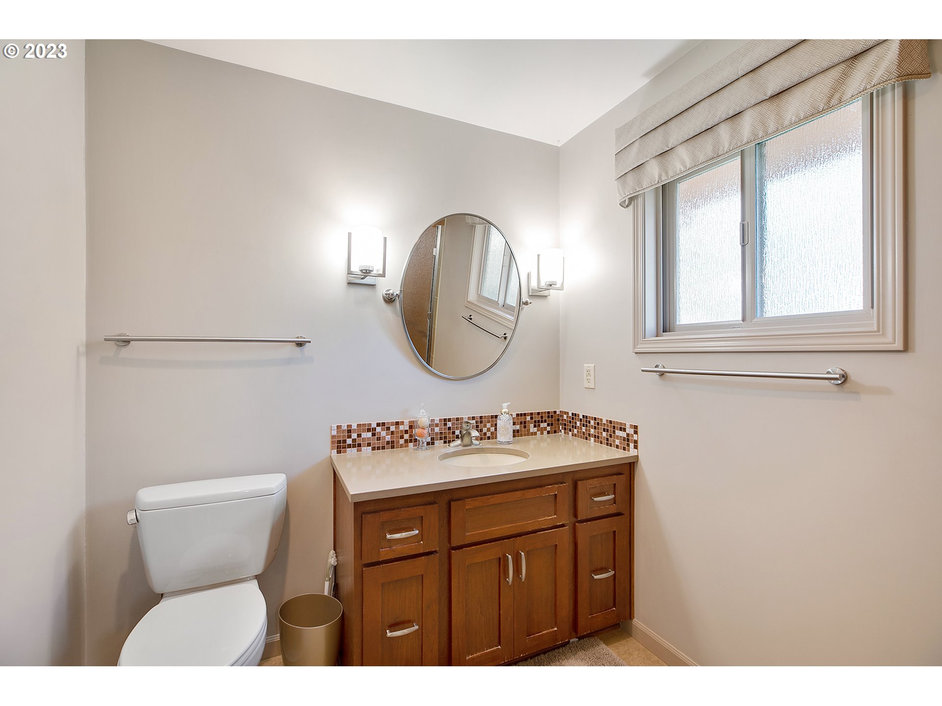 2316 Washington Way Longview, WA 98632 - Photo 16 of 31 a bathroom with a toilet sink and mirror