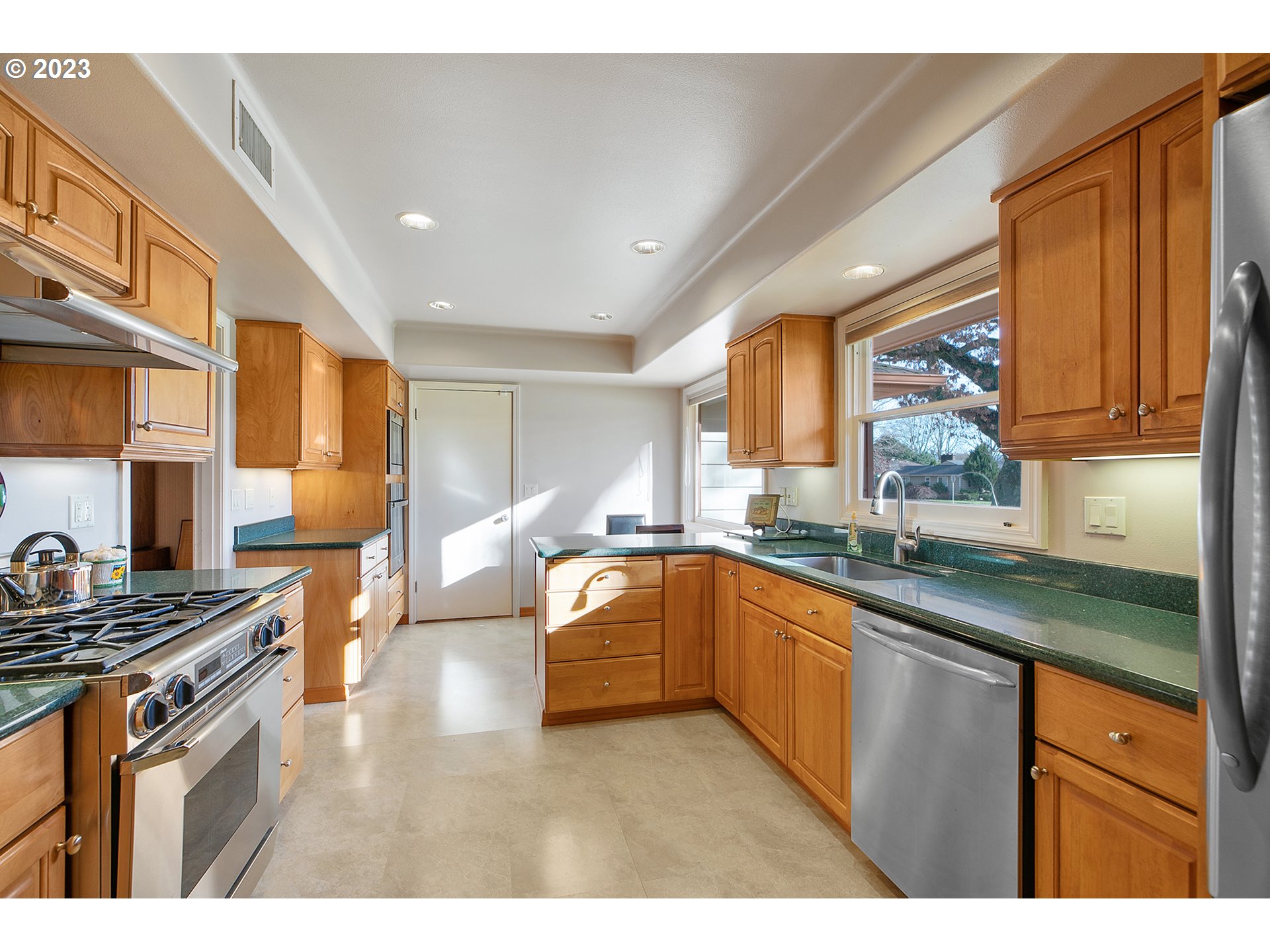 2316 Washington Way Longview, WA 98632 - Photo 6 of 31 a kitchen with stainless steel appliances granite countertop a sink stove and refrigerator