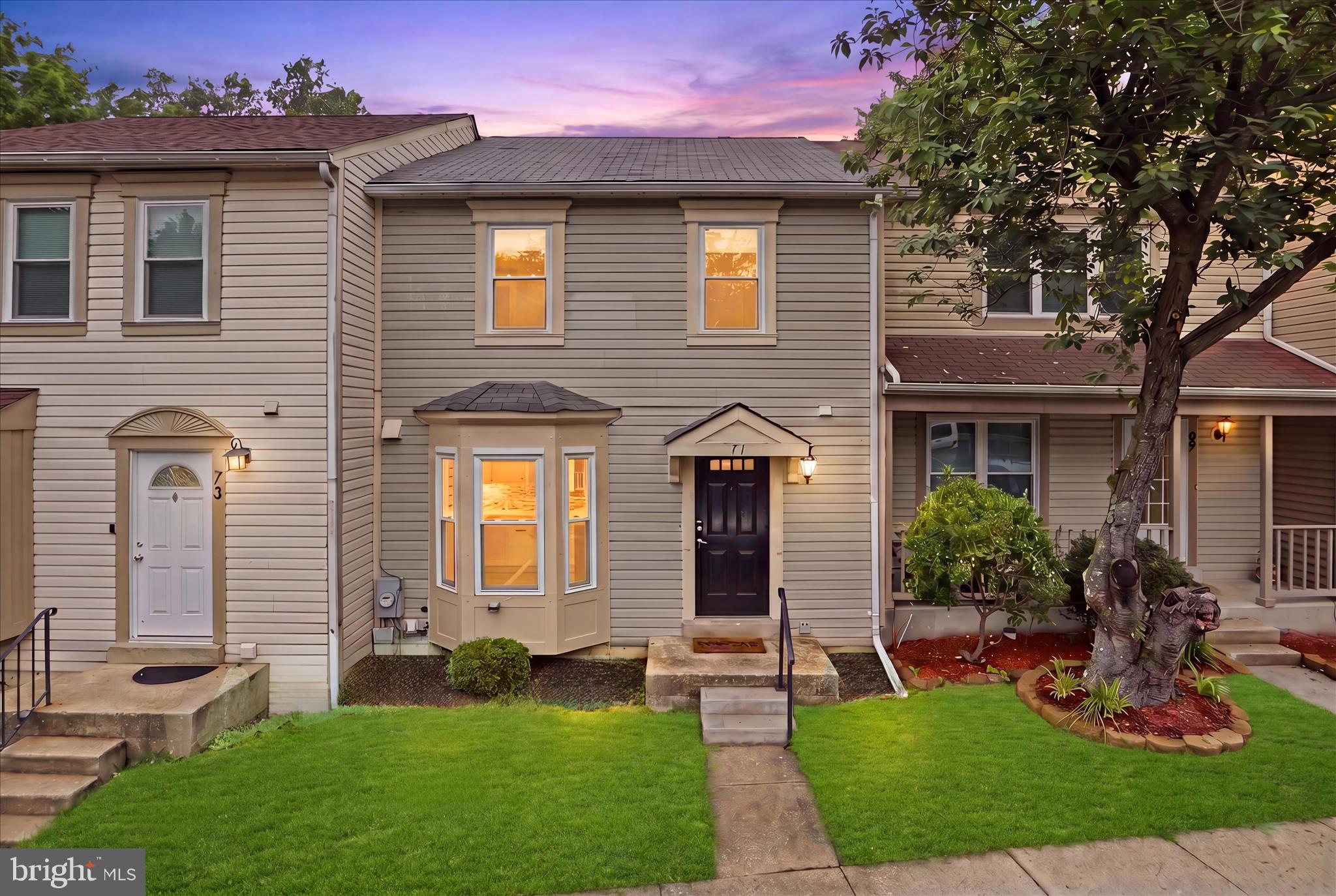 71 Kinsman View Circle Silver Spring, MD 20901 - Photo 1 of 42 a front view of a house with garden